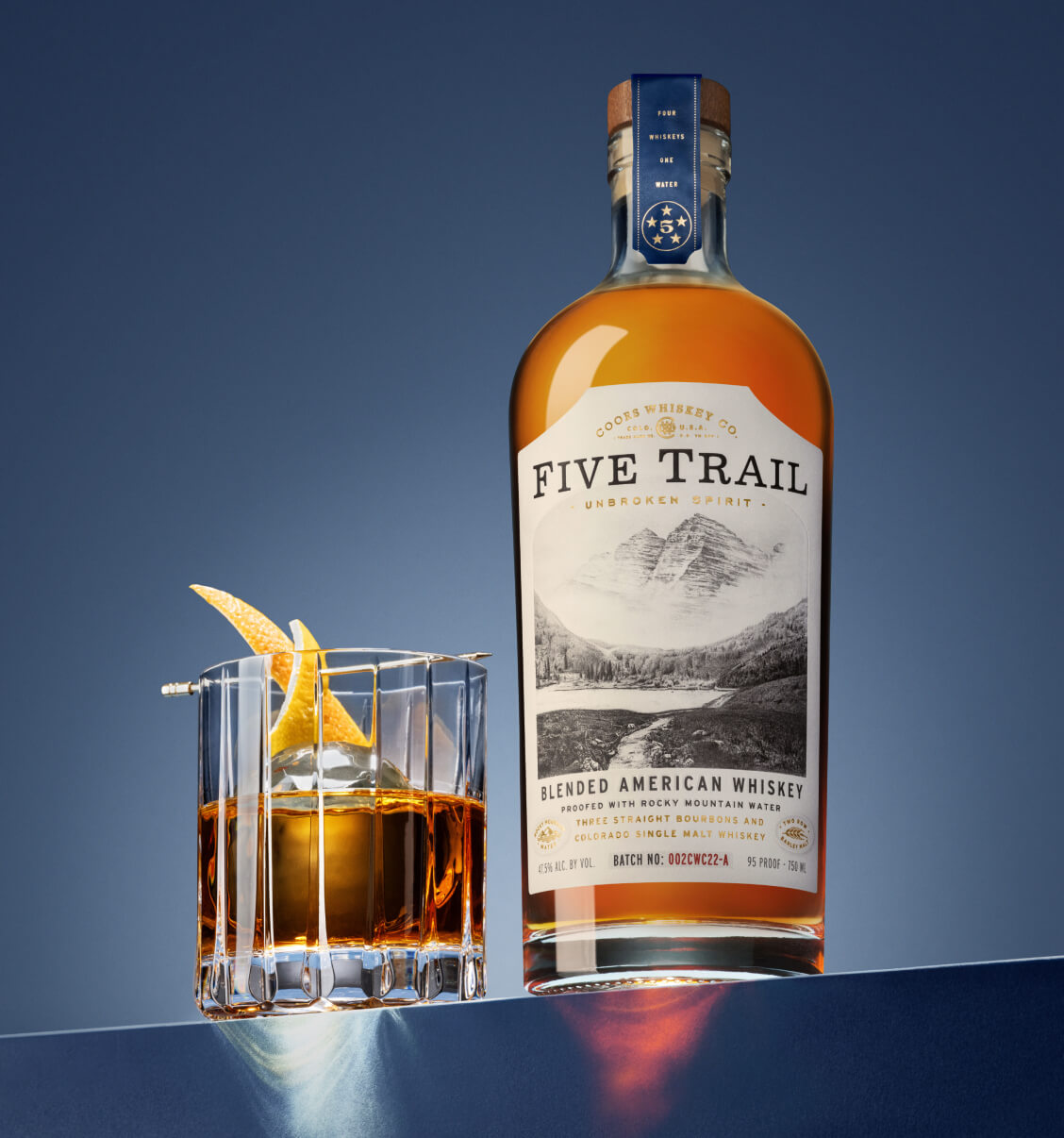 five trail bottle and glass of whiskey