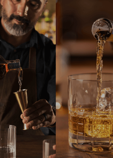 man pouring whiskey on glass